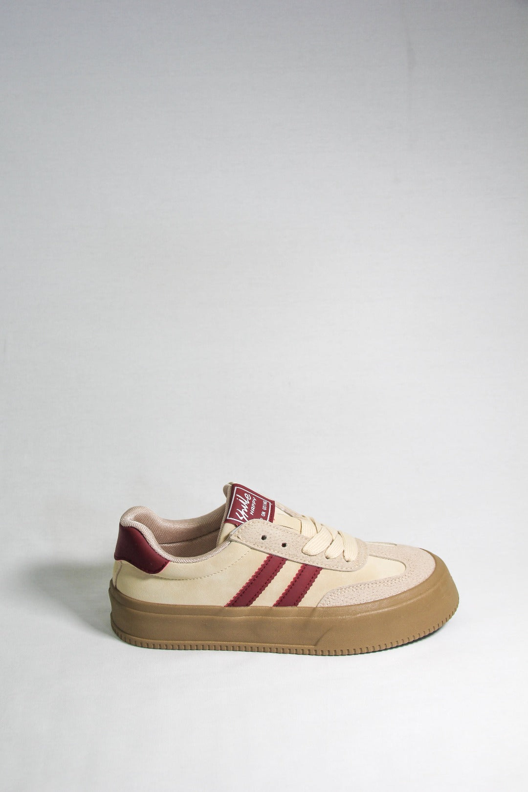 Side view of Tippies beige casual sneaker with burgundy stripes