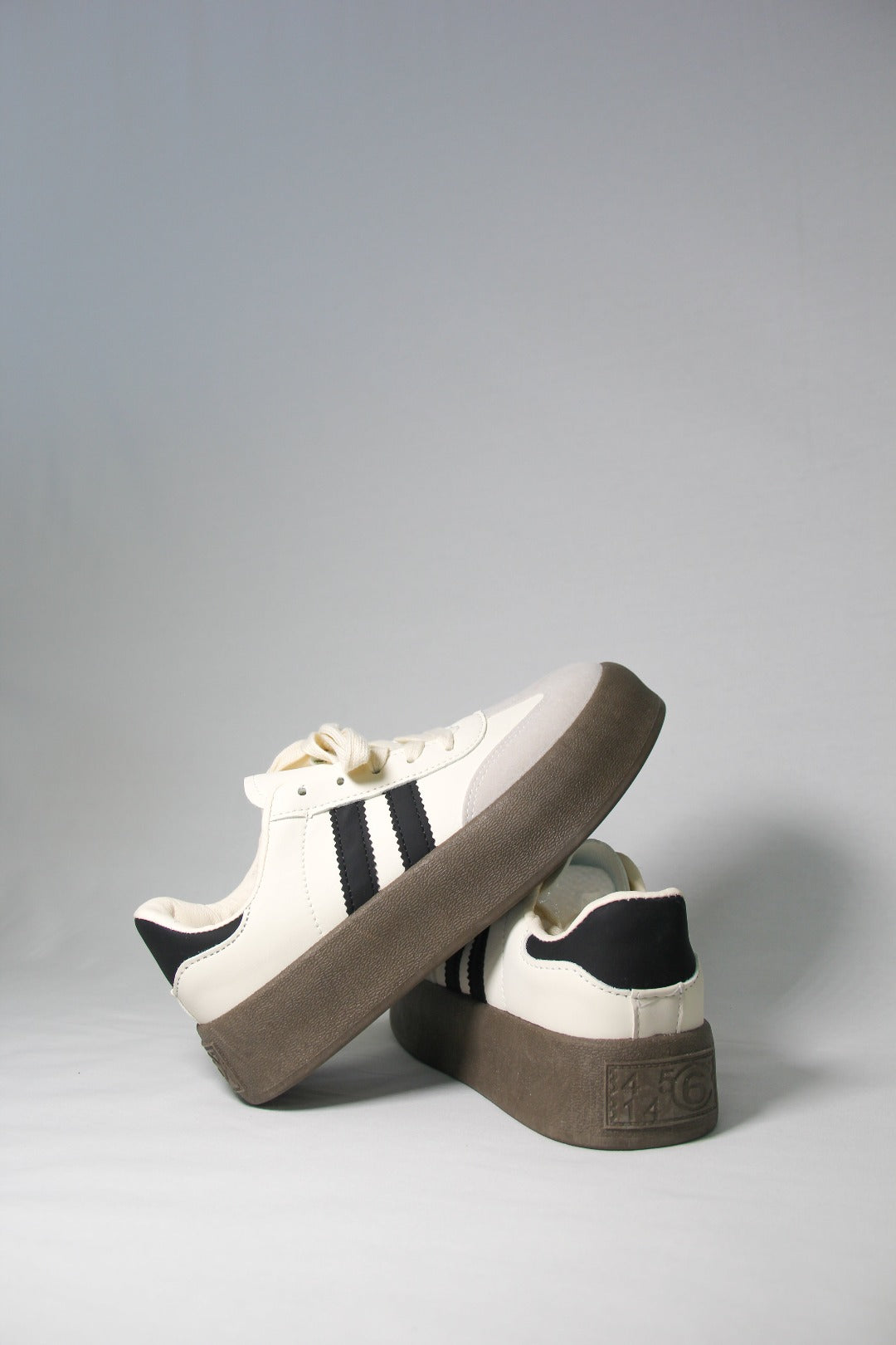 Diagonal product shot featuring Tippies white casual summer sneaker