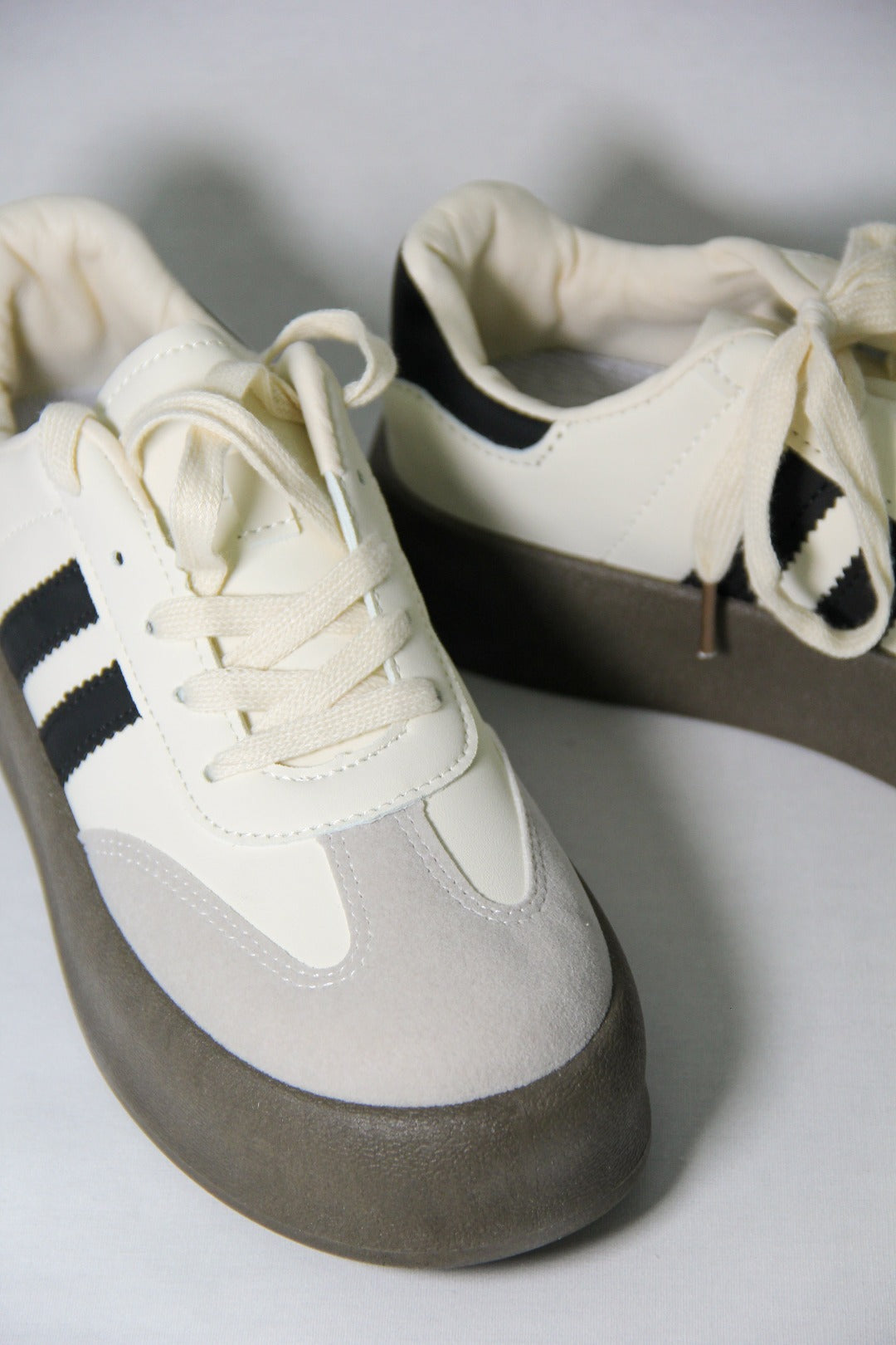 Close up shot of Tippies white casual summer sneakers