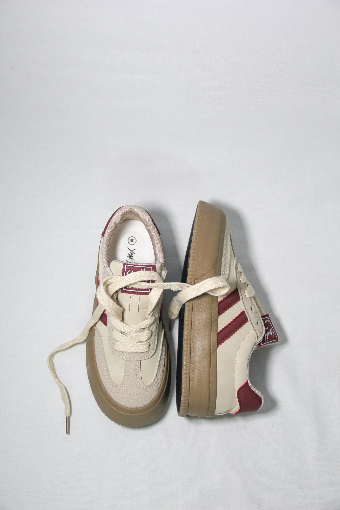 Alternate angle of Tippies beige casual sneaker with burgundy stripes 