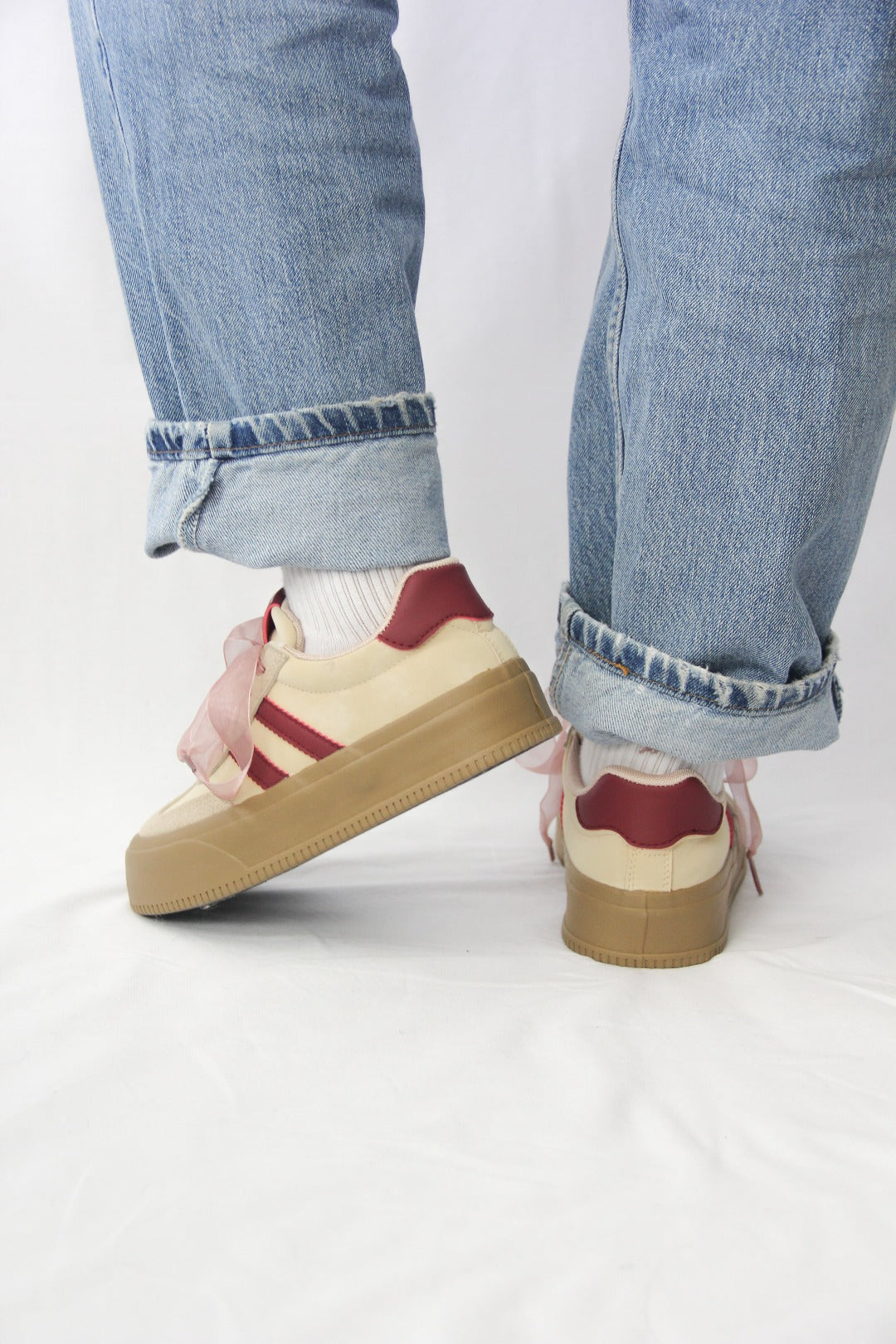 Back view of Tippies white casual sneakers with burgundy stripes